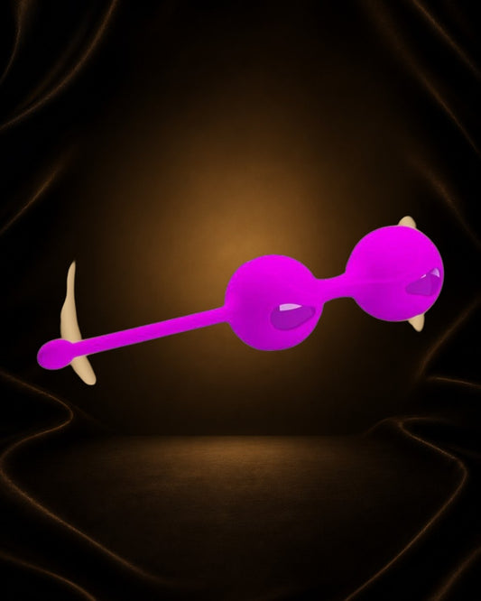 Bolas Kegel Éxtasis Boutique de silicona suave en color fucsia, para fortalecimiento pélvico y placer.
