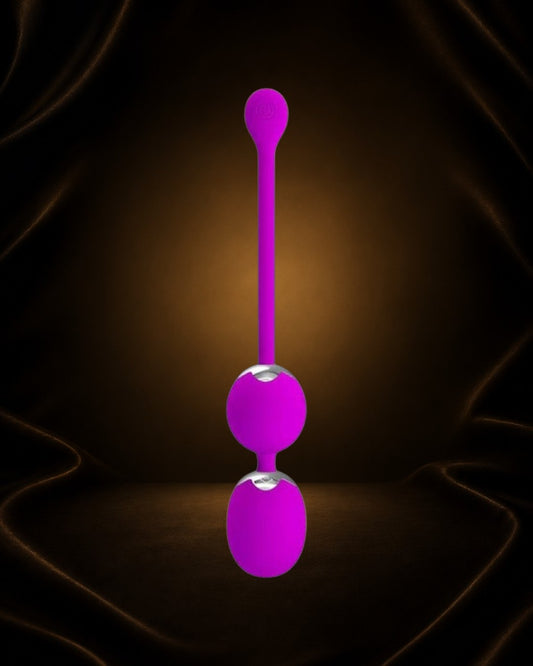Bolas Kegel con vibración Éxtasis Boutique en color morado, de silicona, con dos esferas y un extremo con forma de lágrima.