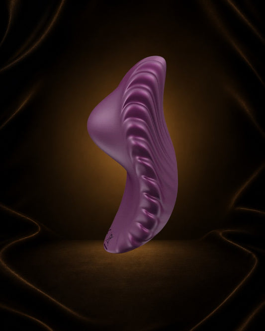 Vibrador de bragas Éxtasis Boutique Pearl de silicona morada con acabado perlado y vibraciones potentes.
