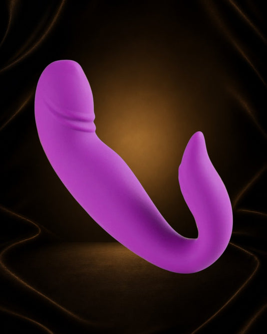 Vibrador y succionador morado de Éxtasis Boutique con forma ergonómica y estimulación dual.