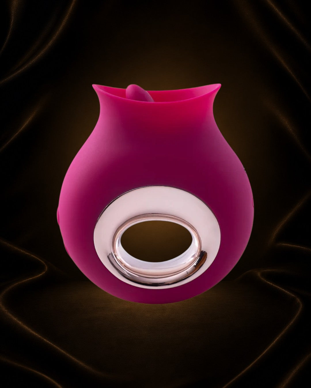 Éxtasis Boutique Alvina vibrador para clítoris de silicona rosa con anillo metálico y estimulador interno.