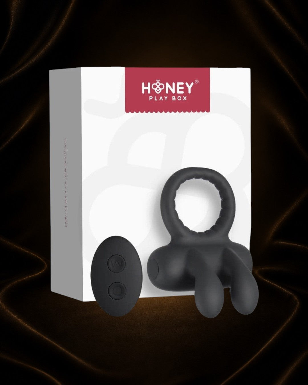 Éxtasis Boutique Anillo Vibrador Robbie negro de silicona con estimulador de clítoris y control remoto.