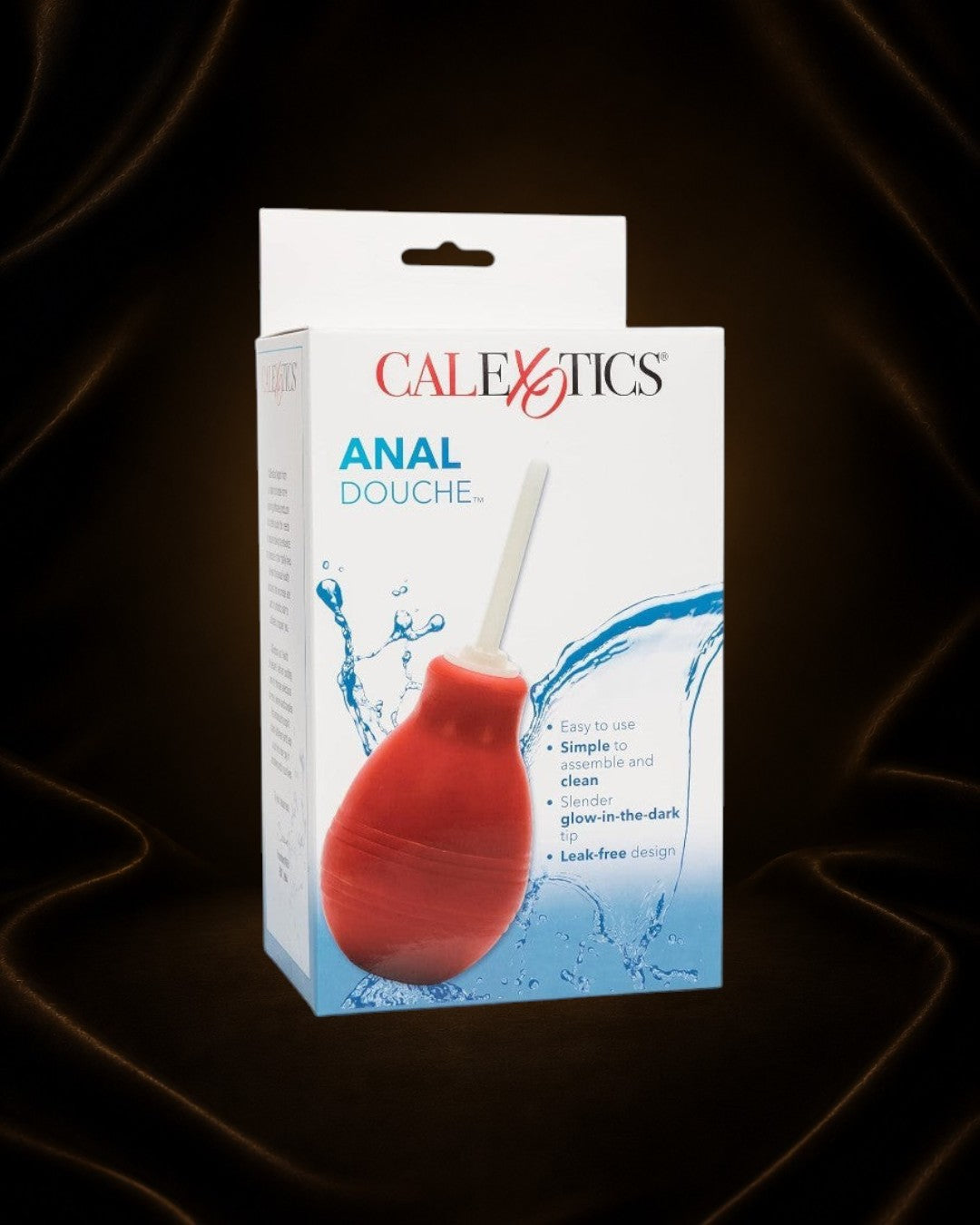 Éxtasis Boutique enema ducha anal roja de plástico ABS y caucho, con aplicador cónico y punta que brilla en la oscuridad.