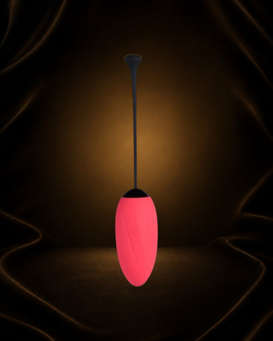 Éxtasis Boutique Vibrador Love Egg rosa de silicona, discreto, con control remoto y cordón de extracción.