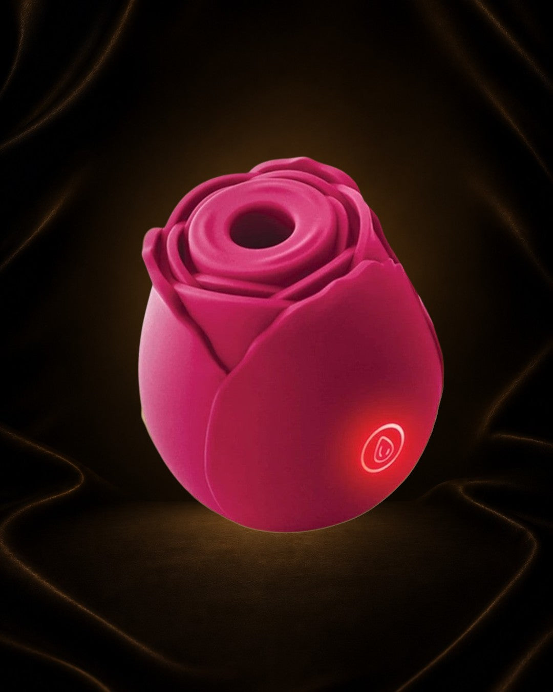 Éxtasis Boutique Succionador The Rose Recargable, vibrador con tecnología de aire pulsante en forma de rosa, color fucsia.