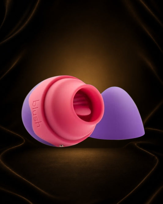 Vibrador Aria Flutter Tongue de Éxtasis Boutique en silicona púrpura y rosa con lengua vibratoria y 7 modos de vibración.
