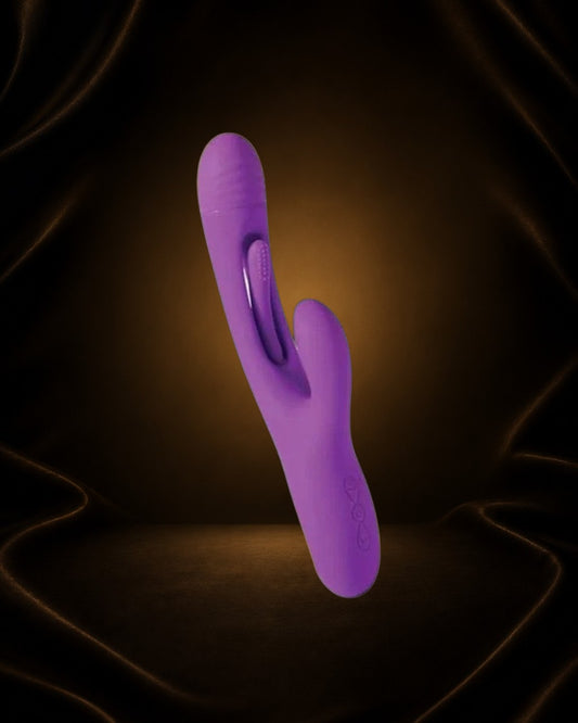 Vibrador Bora de Éxtasis Boutique morado con forma de conejito para estimulación G y clitoriana, con múltiples velocidades.