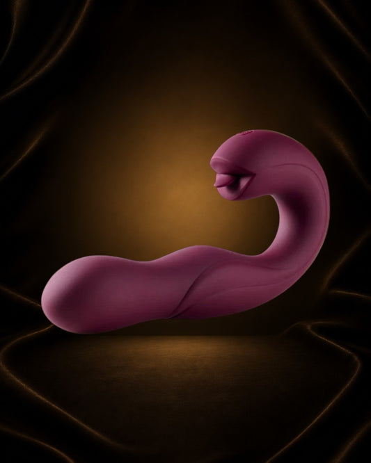 Vibrador de punto G Éxtasis Boutique morado con cabeza giratoria y lamedor de clítoris. Diseño ergonómico.